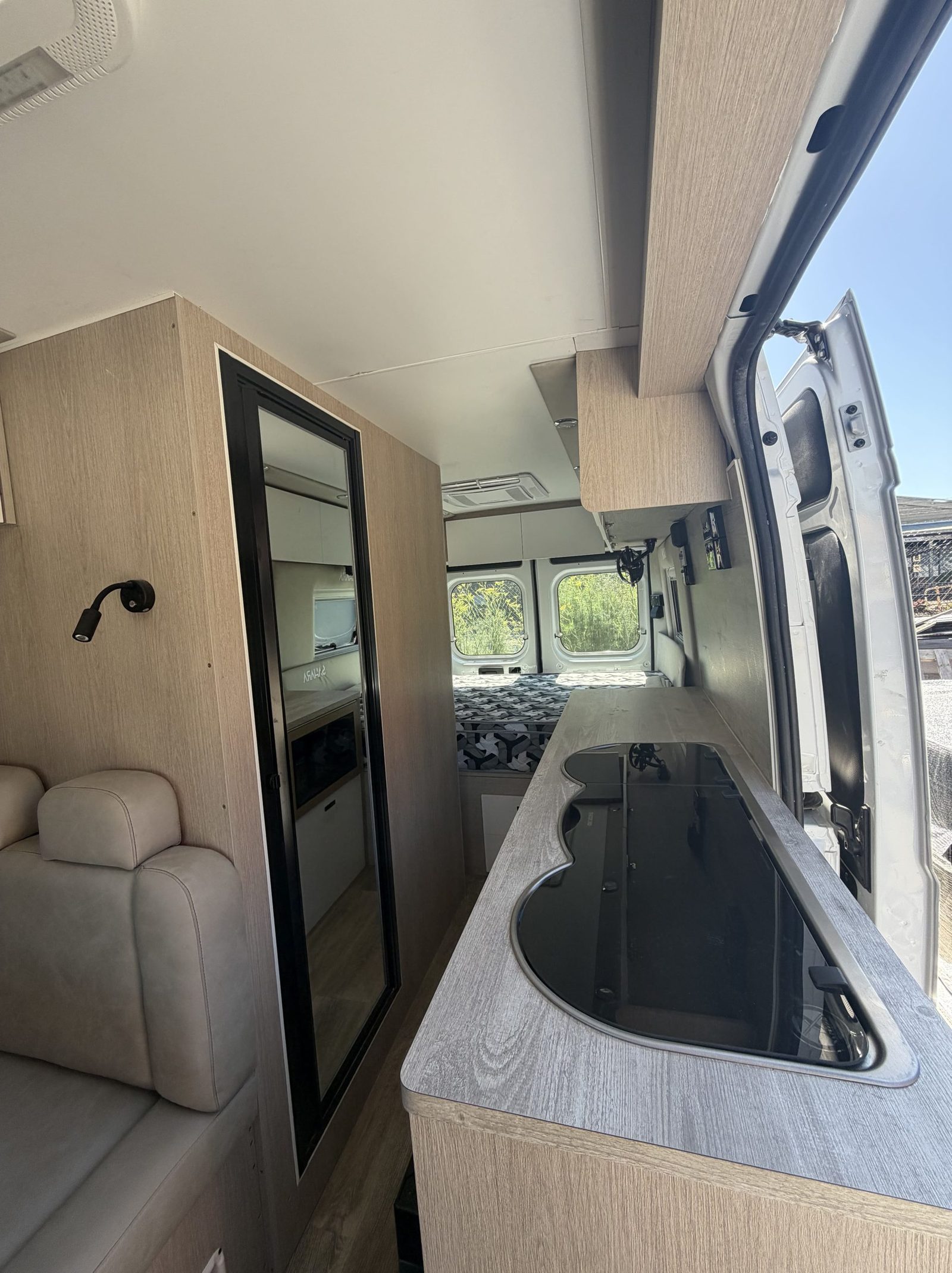Interior lounge and kitchen of a Sahara custom van conversion